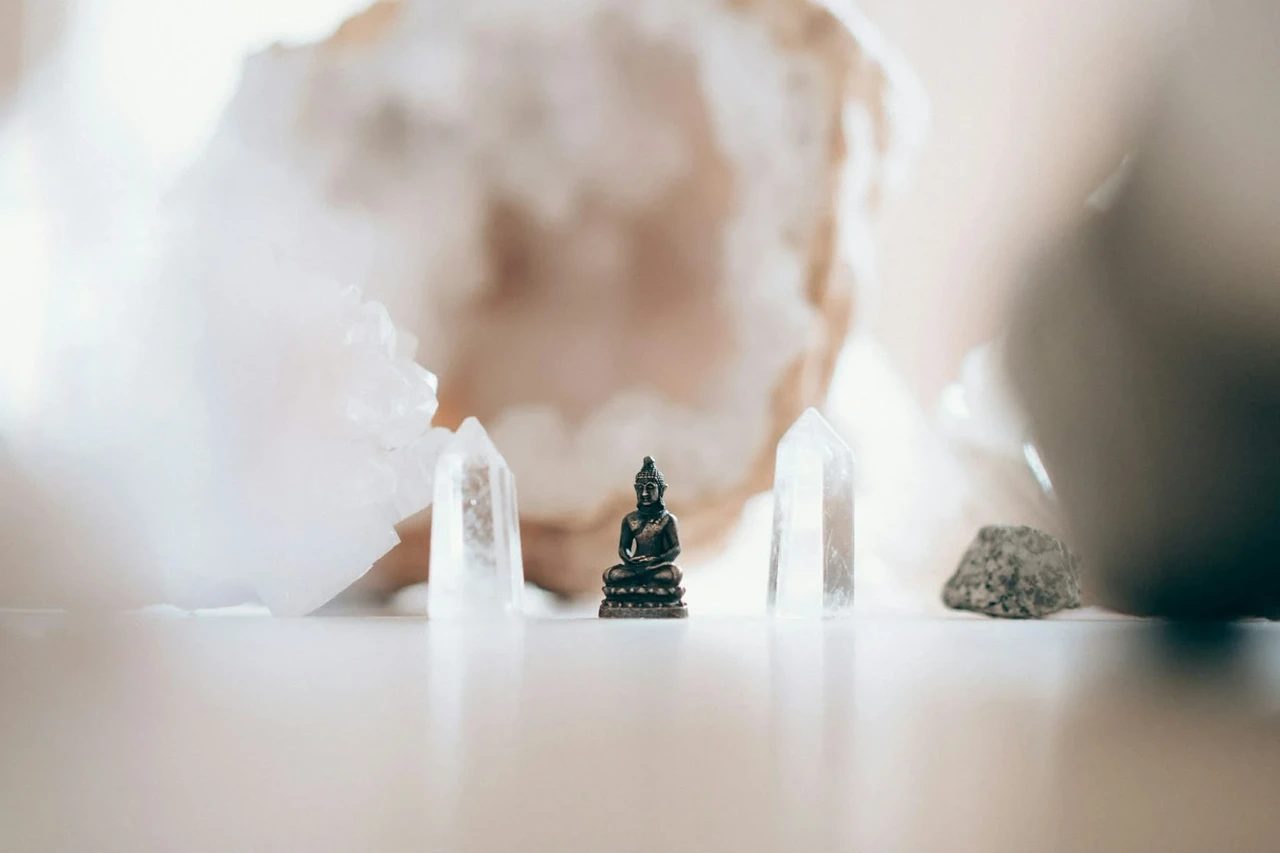 Buddha statue and crystals in gentle light