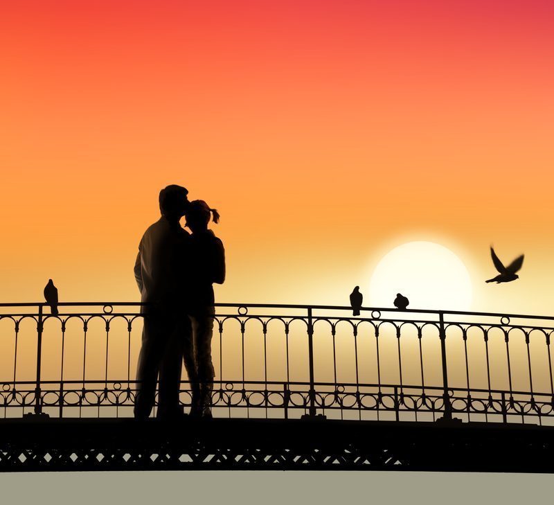 A couple on a bridge in peaceful nature